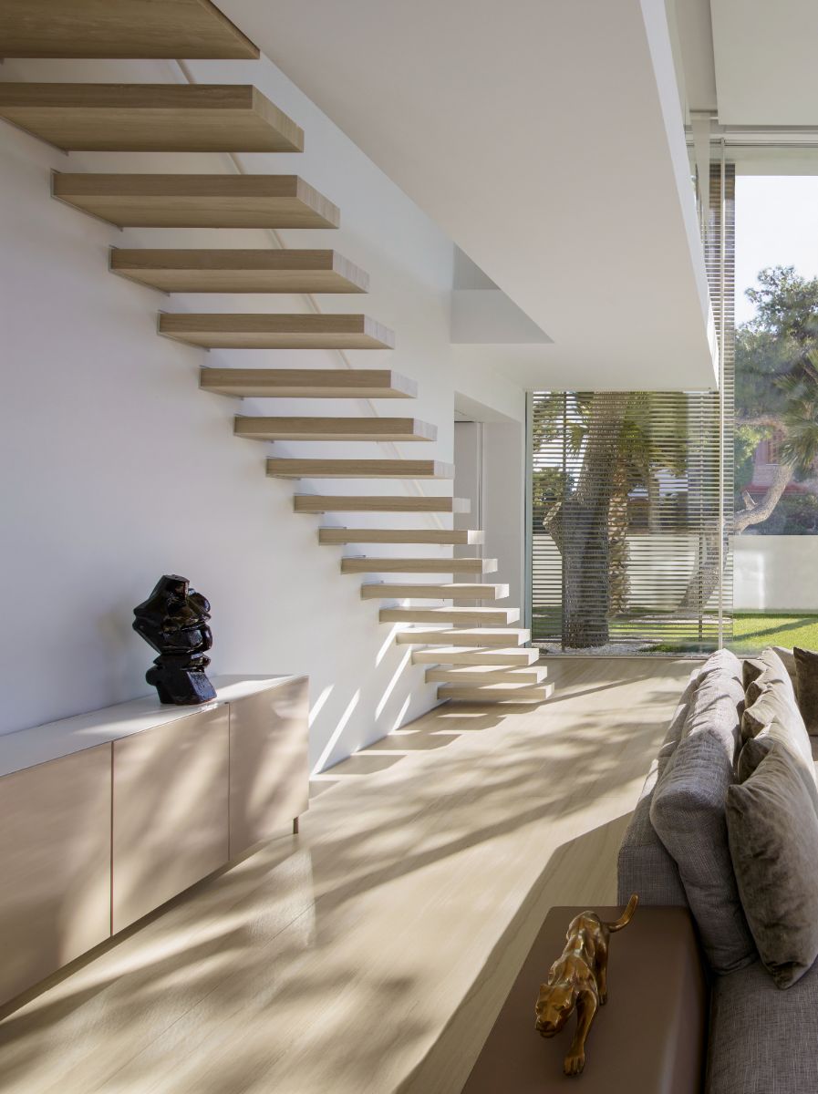 The floating wooden stairs from the patio.