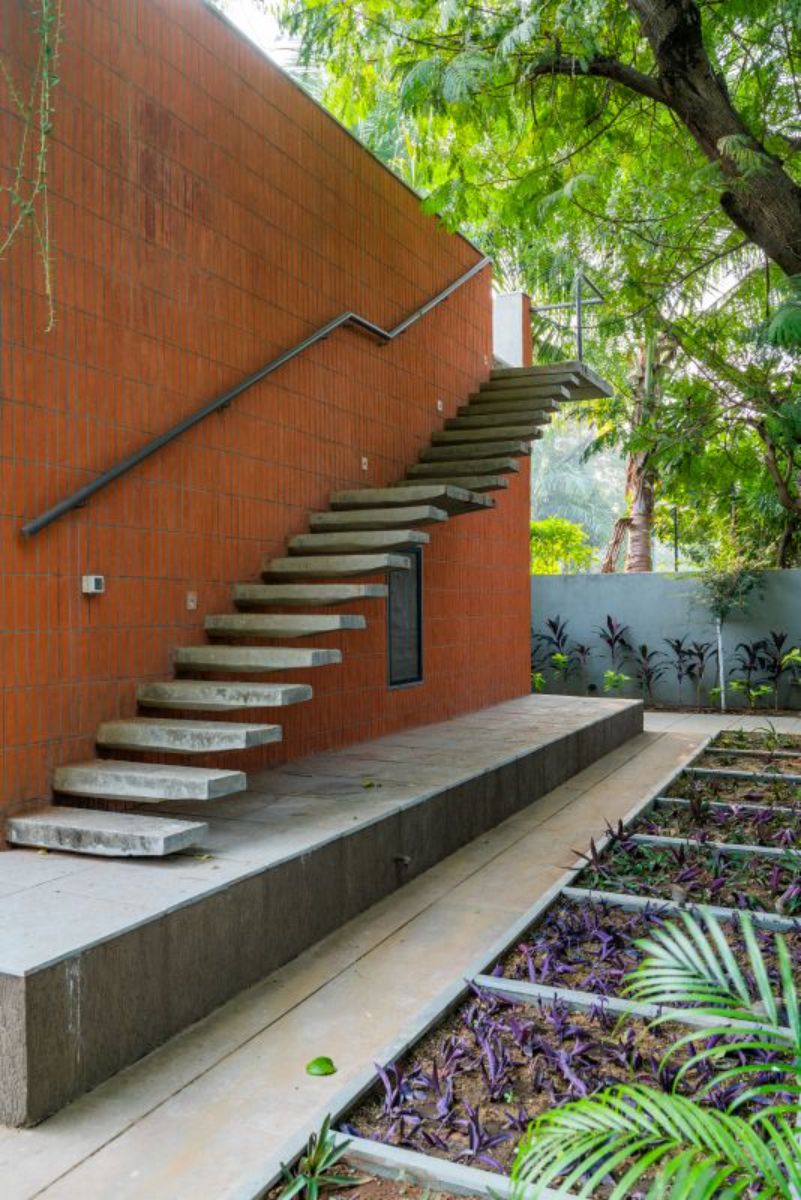 The terrace is accessible via floating rcc steps jutted from the load bearing wall.