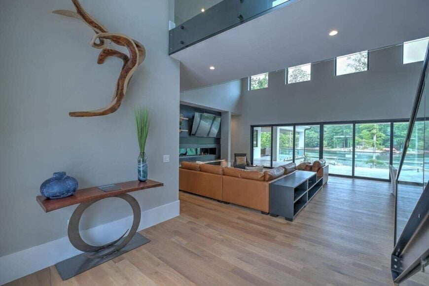 The foyer has a contemporary console table and a great view of the open living space.