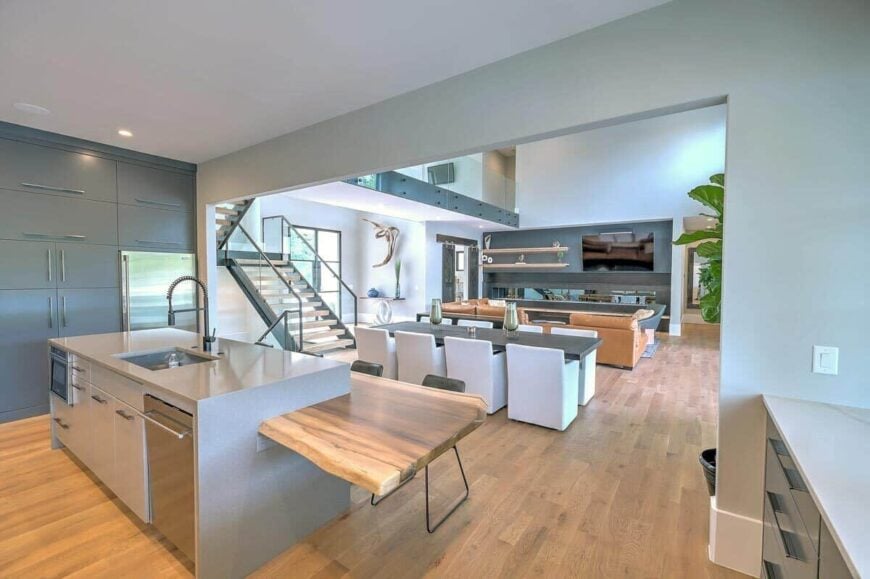 A large opening separates the kitchen from the dining area and living room.