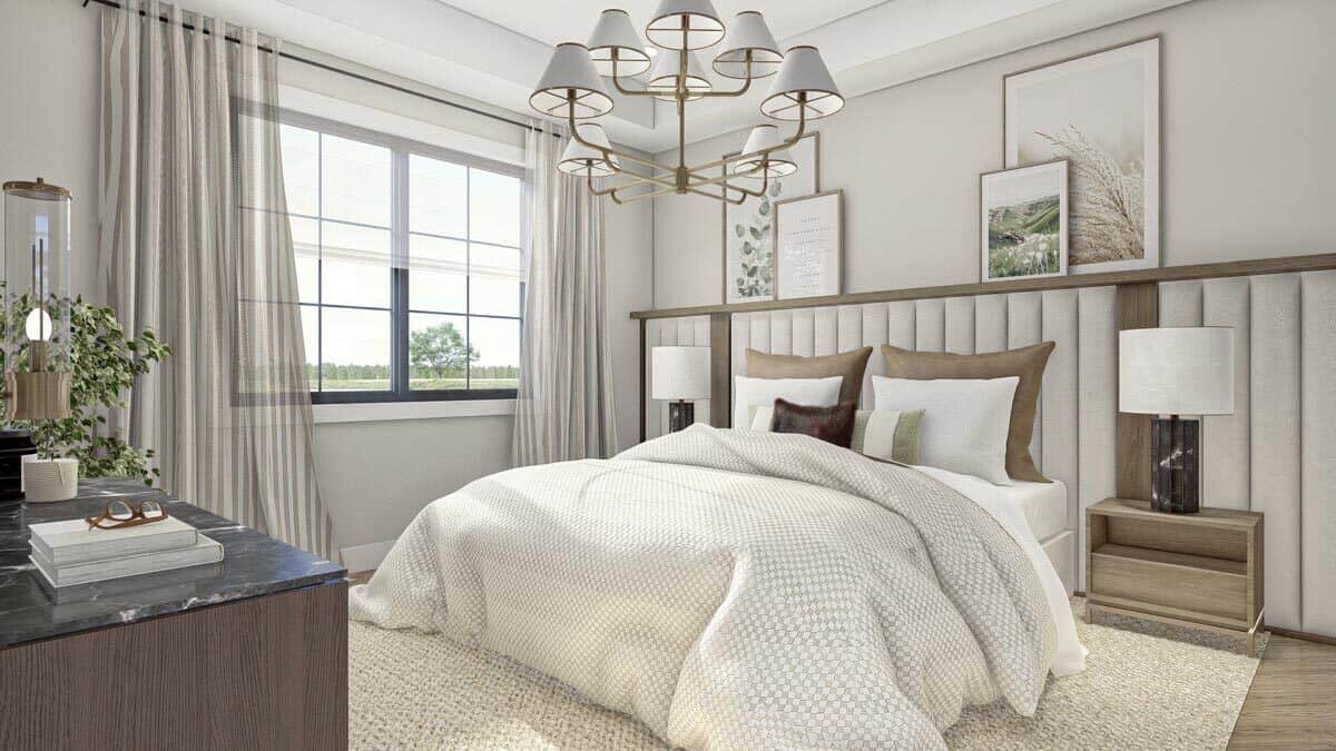 The primary bedroom features a comfy bed with a bespoke headboard that runs the width of the room.