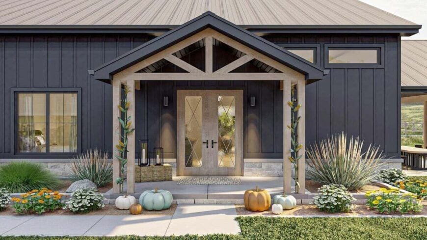 The entry porch has a french front door and a gable roof framed with exposed trusses.