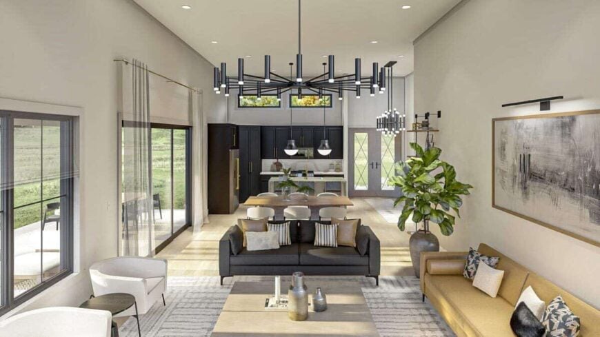 An open layout view of the living room, dining area, and kitchen with a hardwood floor and sliding glass doors that open onto the covered patio.