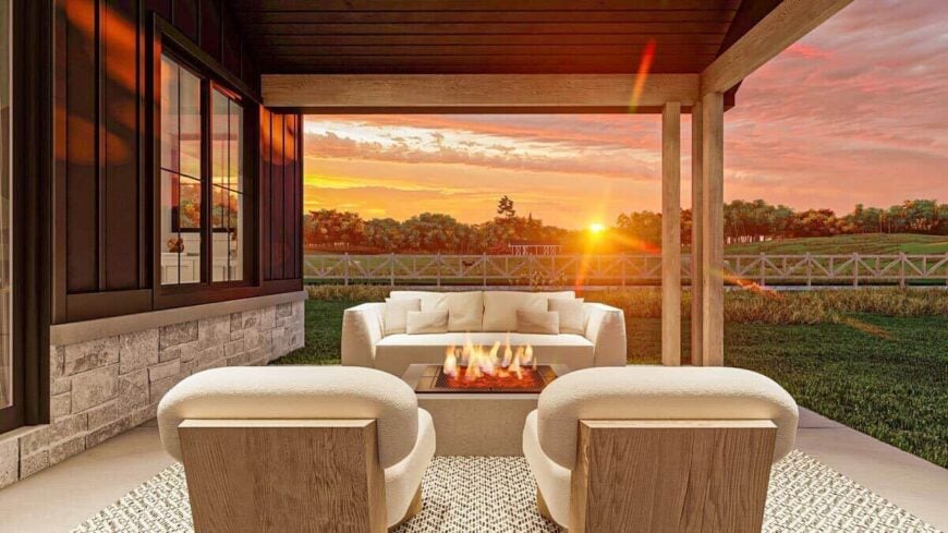 Sunset rendering of the covered patio showcasing its fire pit table surrounded by beige seats.