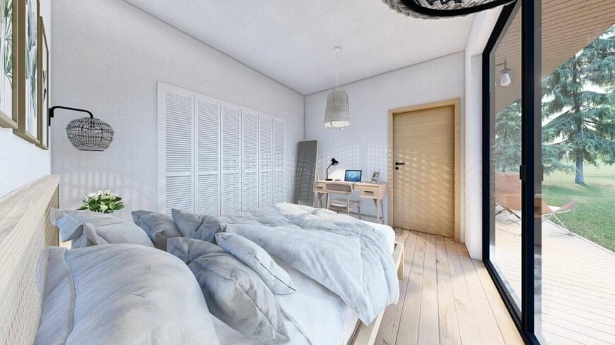 Large sliding glass doors extend the primary bedroom into a covered porch.