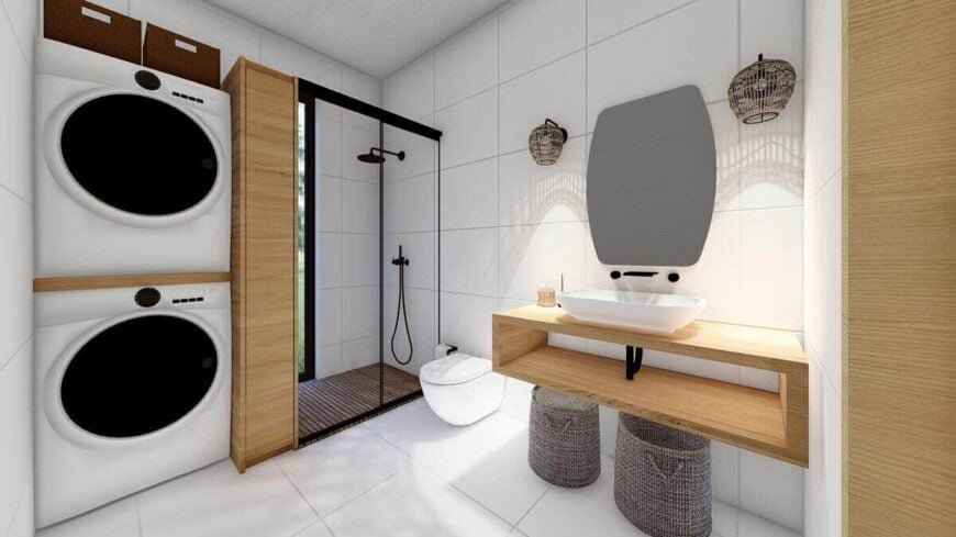 The bathroom is equipped with a floating vanity, a walk-in shower, and stacked washer and dryer.