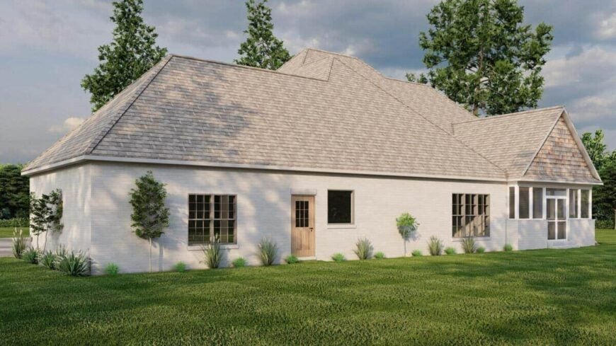 Rear-right rendering with hipped rooflines and a man door to the garage.
