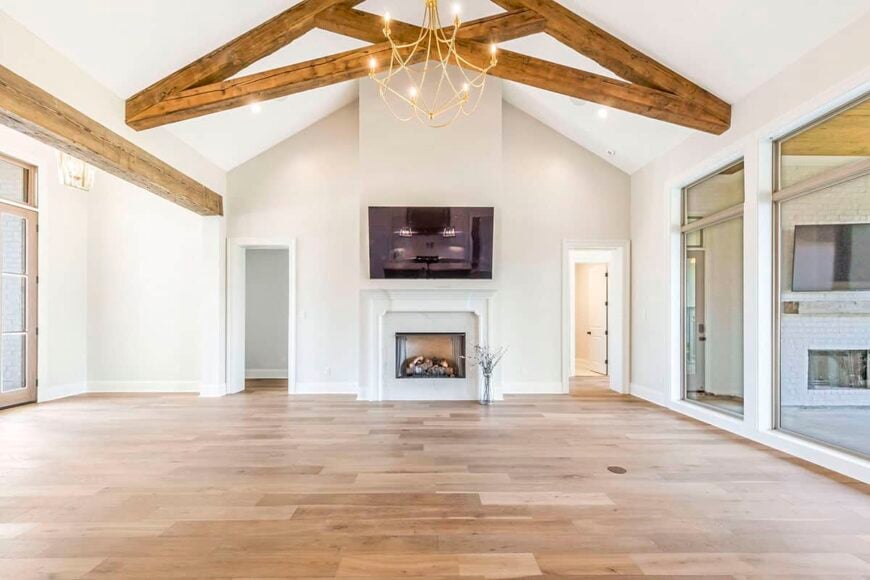 The living room includes a fireplace with a wall-mounted TV on top.