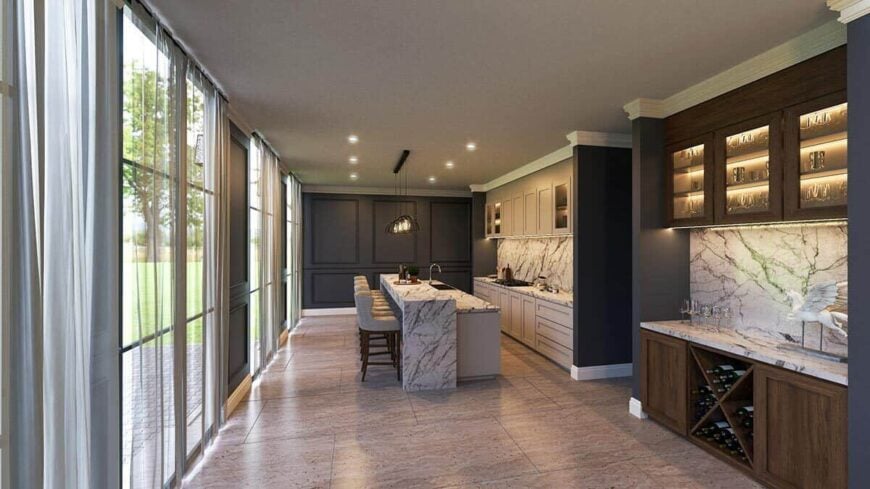 The kitchen offers ample counter space, a built-in wine rack, and a breakfast island with a raised eating bar.