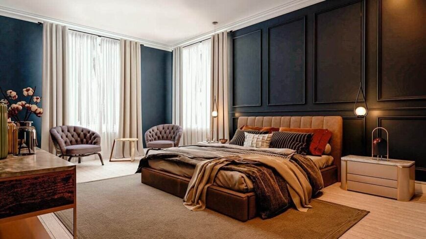 The primary bedroom features full-height wainscoting, a cozy hardwood floor, and a sitting area by the large window.