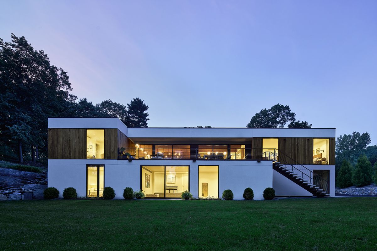 A formalized rectangle house that is low to the ground.