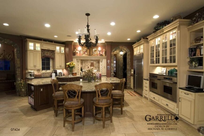 The kitchen offers plenty of storage and a large island incorporated with an eating bar.