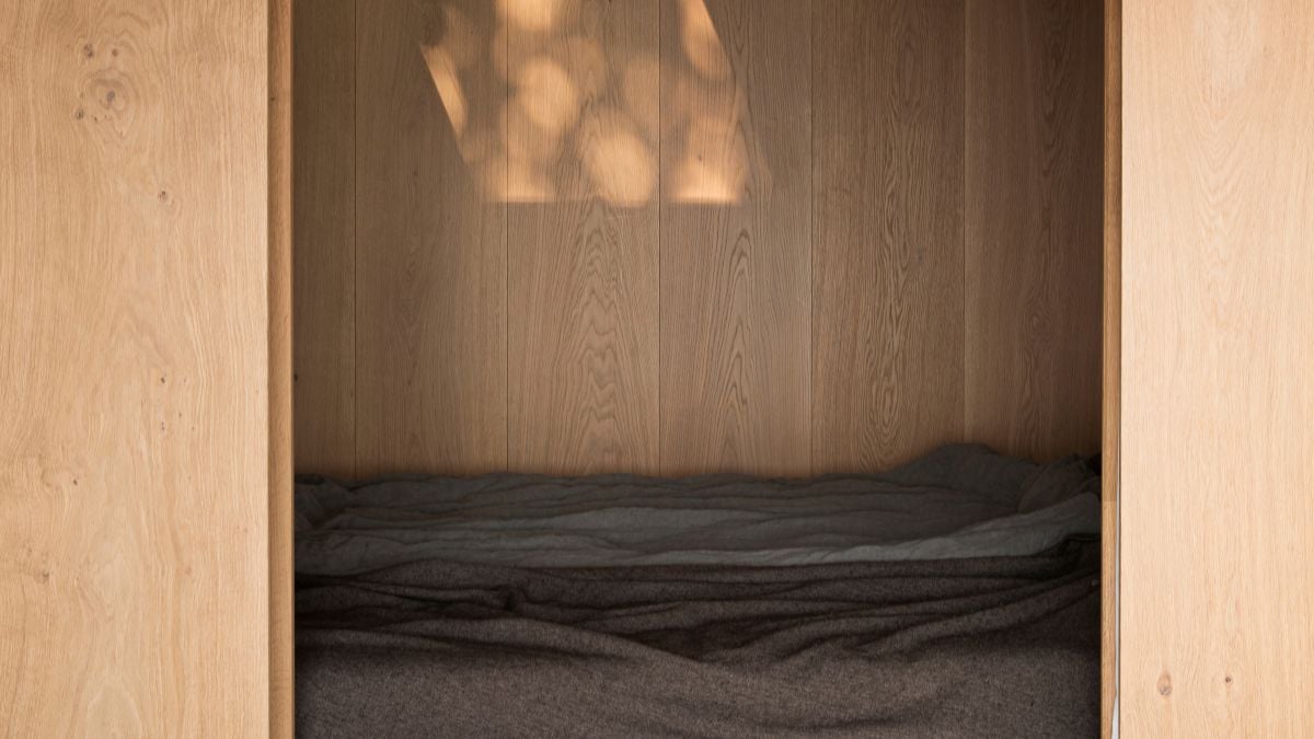 A sophisticated abundance of warm textures and colors are used, evoking a profound sense of home and comfort.