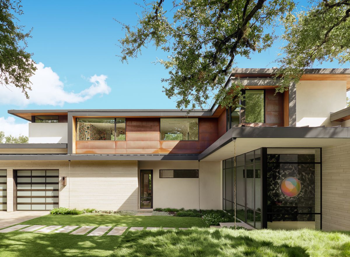 This sprawling home was designed and built 75 feet above Lake Austin on a steep hillside.
