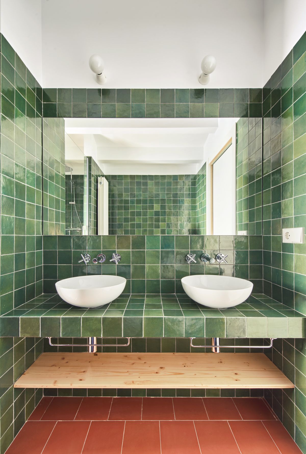 The bathroom has an overmount sink and a tile wall finish.