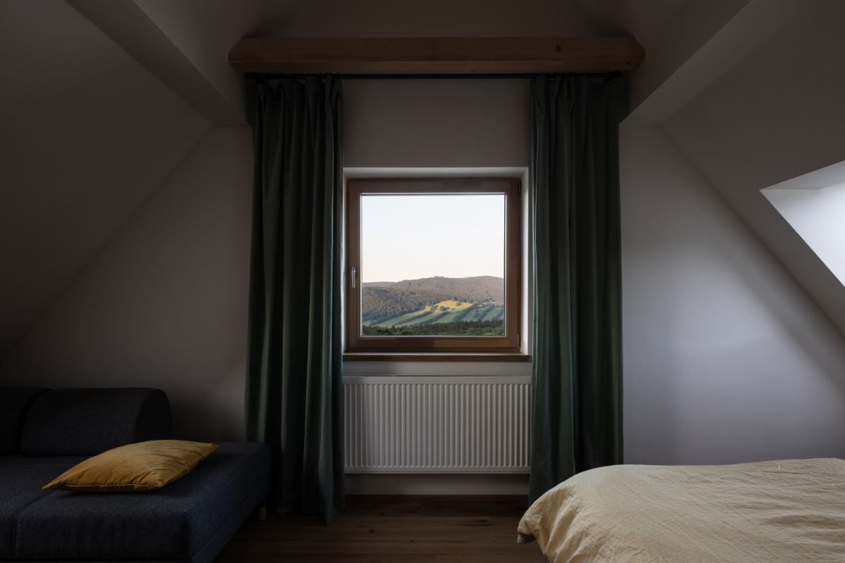 The bedrooms in the attic have a view of the surrounding mountain.