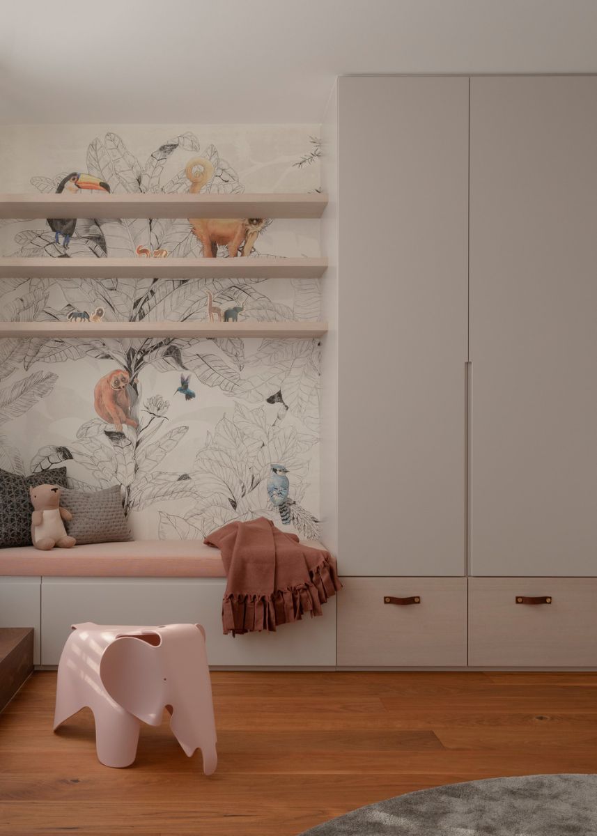 The kids' room, complete with a floor-to-ceiling cabinet and open shelving.