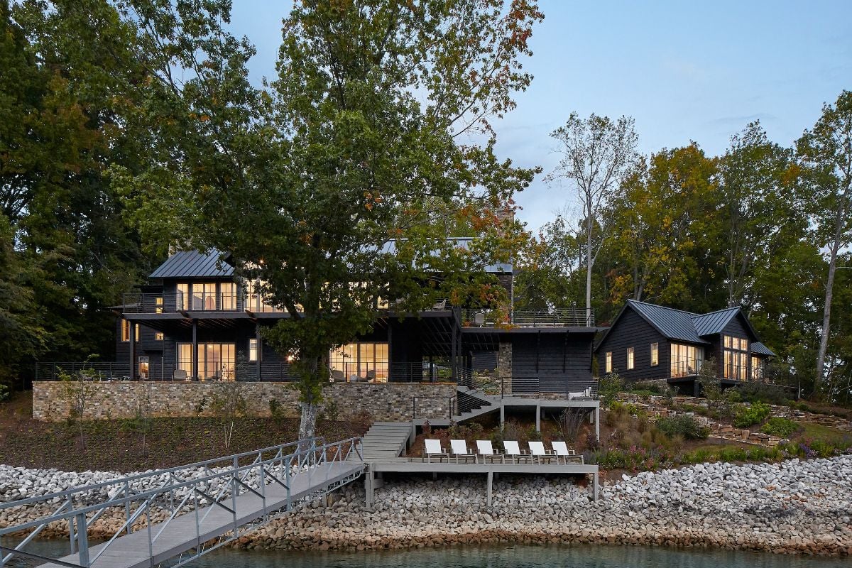 The house features a wooden deck to showcase the beautiful surrounding.