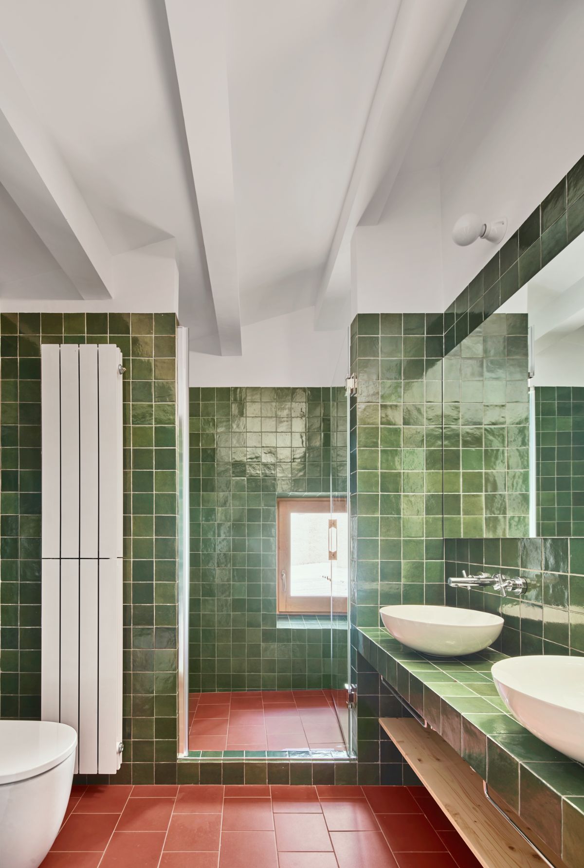 The bathroom has a separate cubicle for the shower.