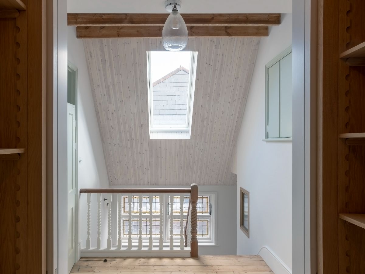 The top landing has a large skylight that lights up the stairs.