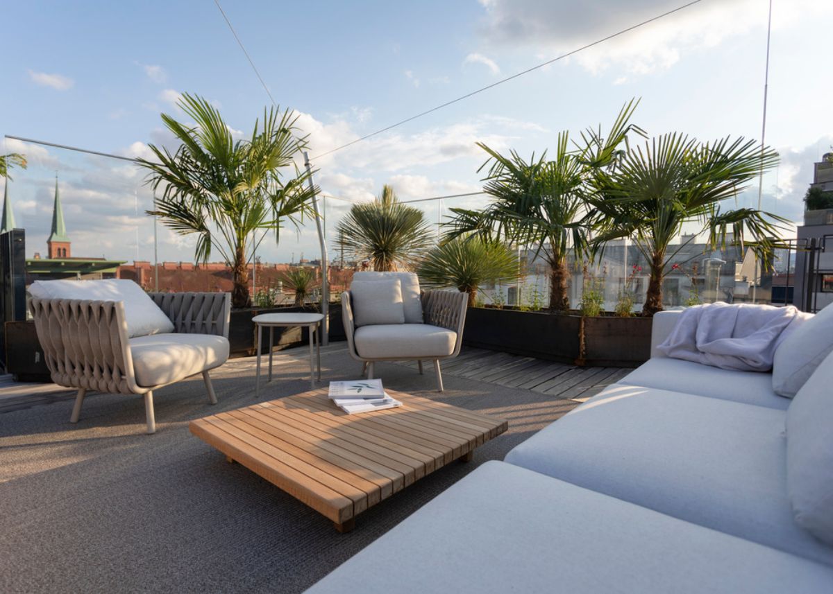 The terraces, which include a stunning roof garden with a pool, outdoor kitchen, and custom-made plant troughs.