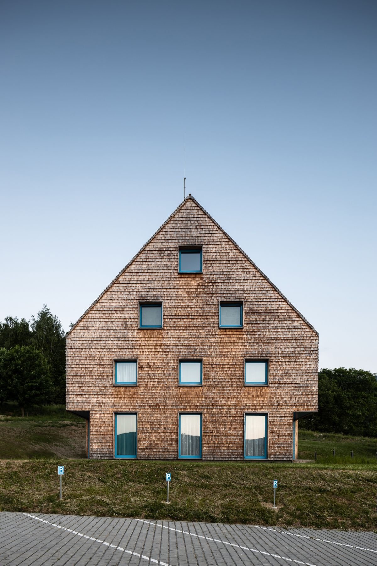 View of the blue house from the road.