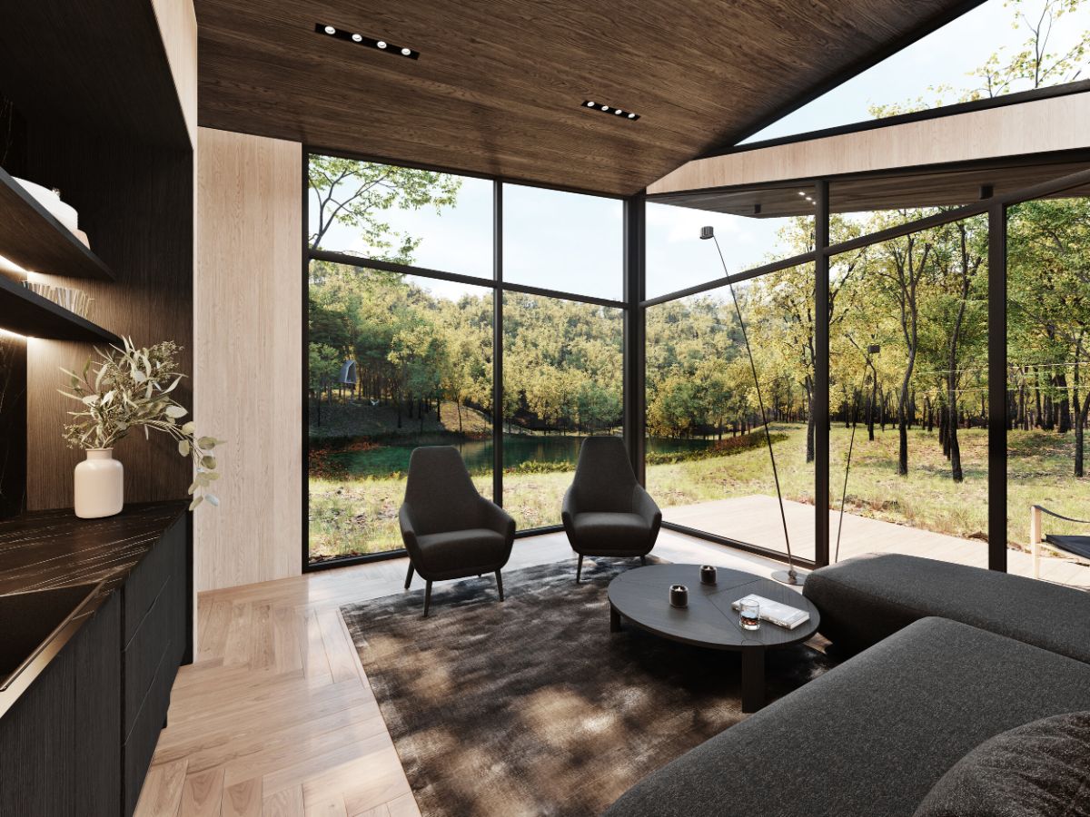 The living room of the guest pods has glass walls to showcase the beauty of the natural surroundings.