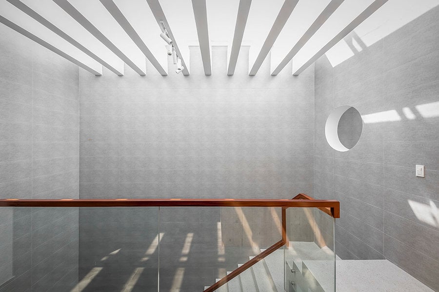 Skylight framed with white beams allows natural light.