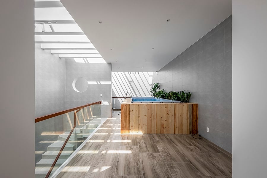 The top level includes a tranquil pool brightened by skylights.