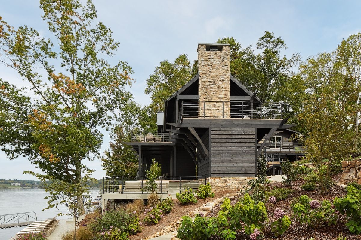 The exterior of the house is made of wood and stone walls giving a rustic feel.