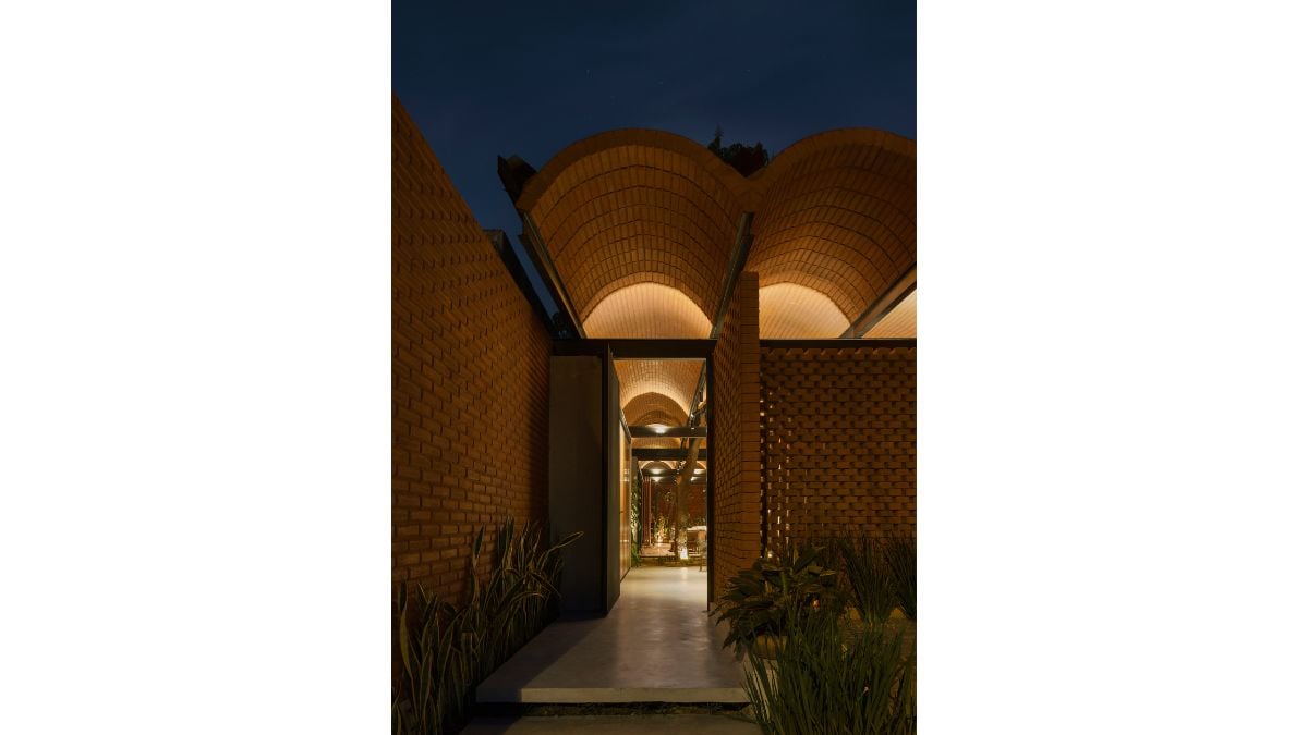 The narrow entryway of the house leads immediately to the property's intermediate space.