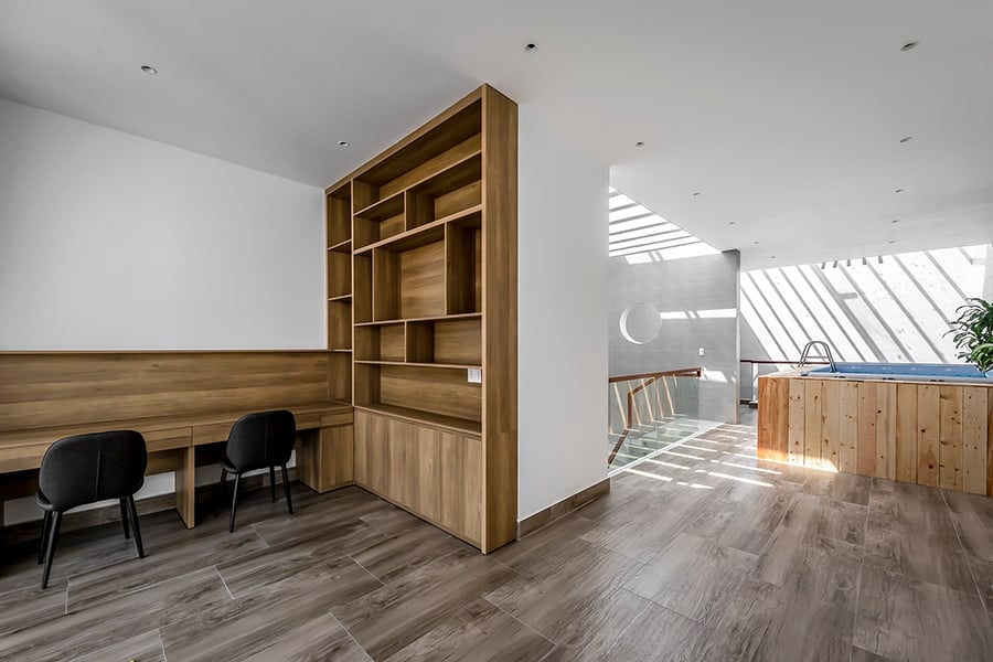 A study nook with a built-in desk and bookcase completes the top level.