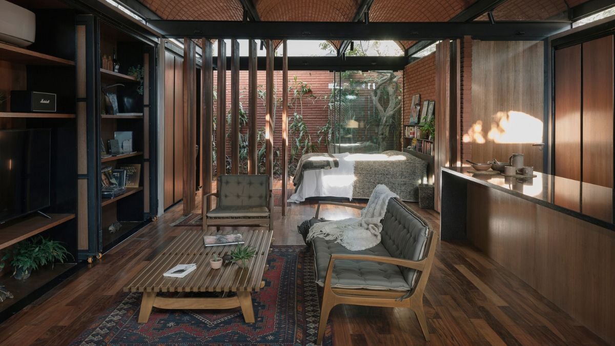 The living room is spacious and has hardwood flooring that matches the other components in the room.