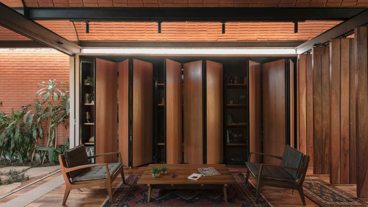 Because it is placed near to the property's intermediate space, the simple guest area appears relaxing and appealing, and the furnishing adds to the area's mood.