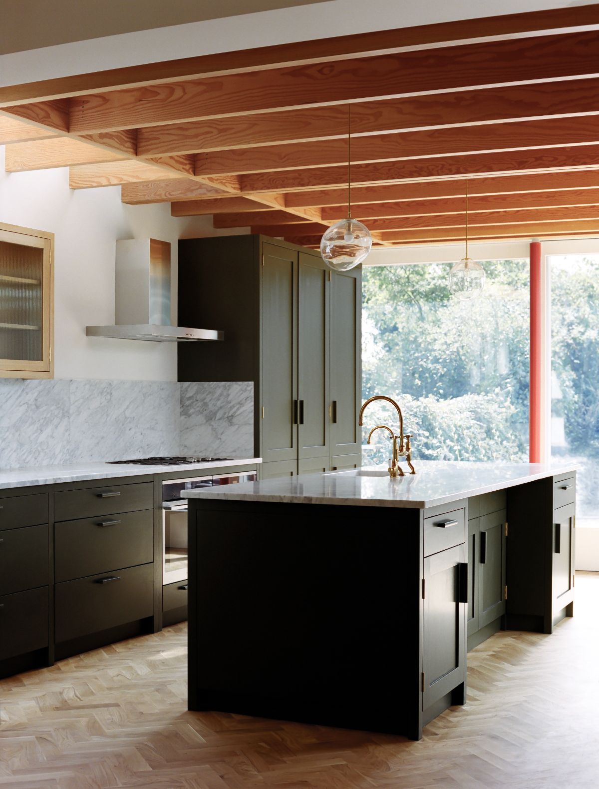 The kitchen has a galley-style layout and a kitchen island with a granite countertop.