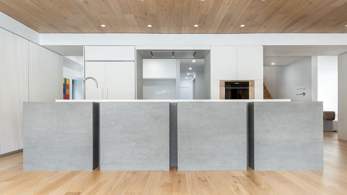 A detailed view of a long rectangular table designed with four square box-like structures, showcasing a unique and modern aesthetic.