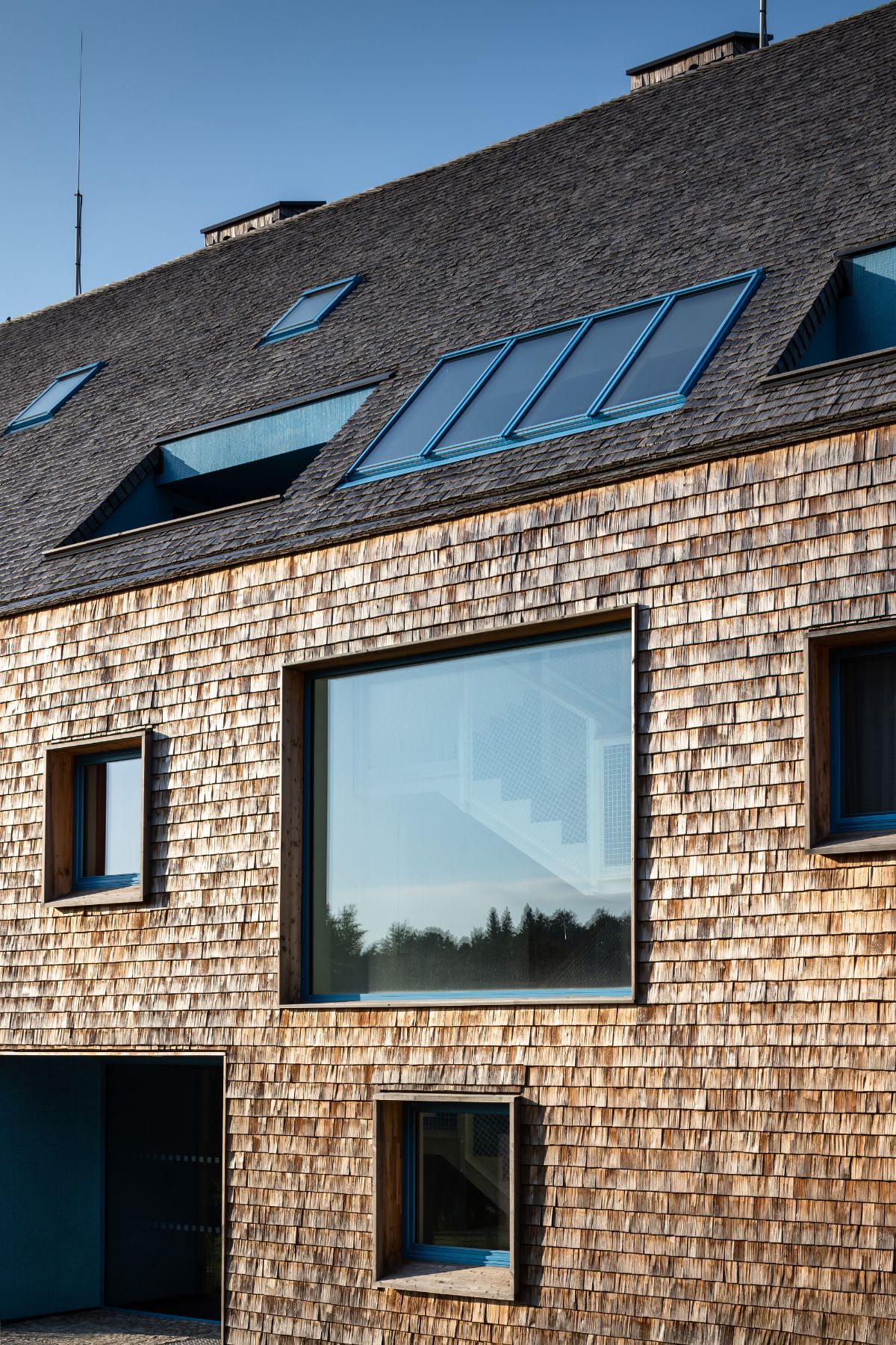 The houses differ in their interior paint that outlines the windows and doors.