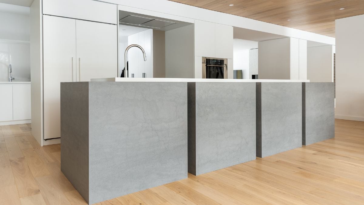 A detailed view of a long rectangular table designed with four square box-like structures, showcasing a unique and modern aesthetic.