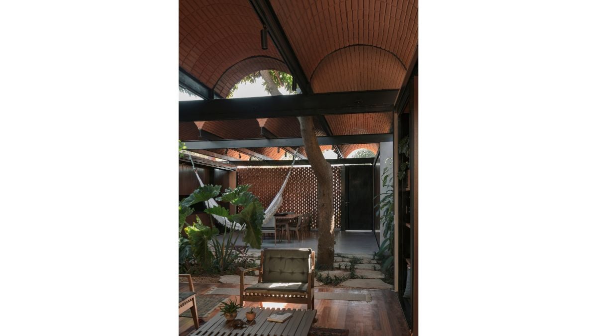 From the peaceful guest area, you can see the dining area and the hammock.