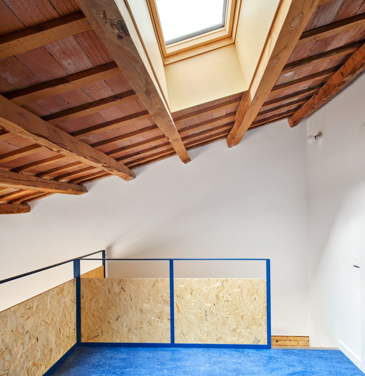 The upstairs loft has a skylight to help light the room.