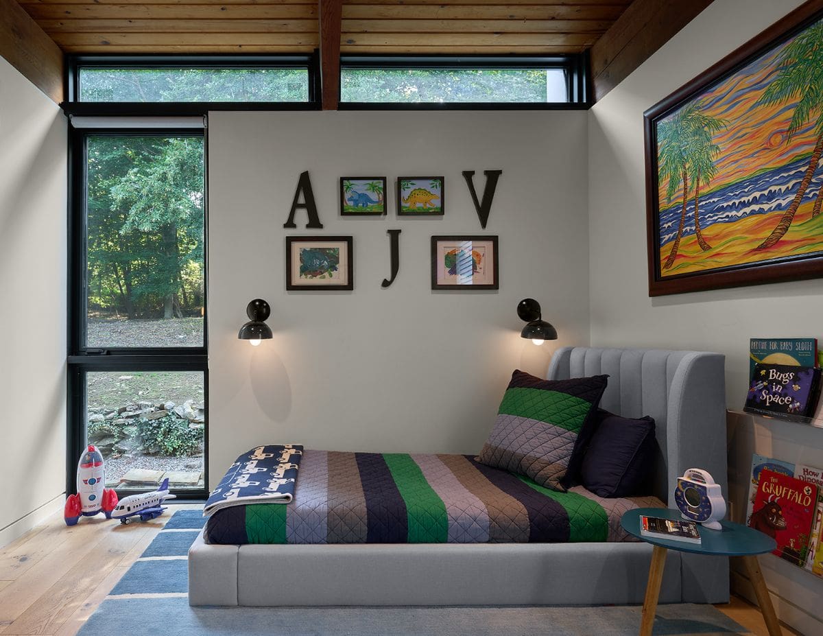 The boys' room, which has a glass door that leads to the backyard.