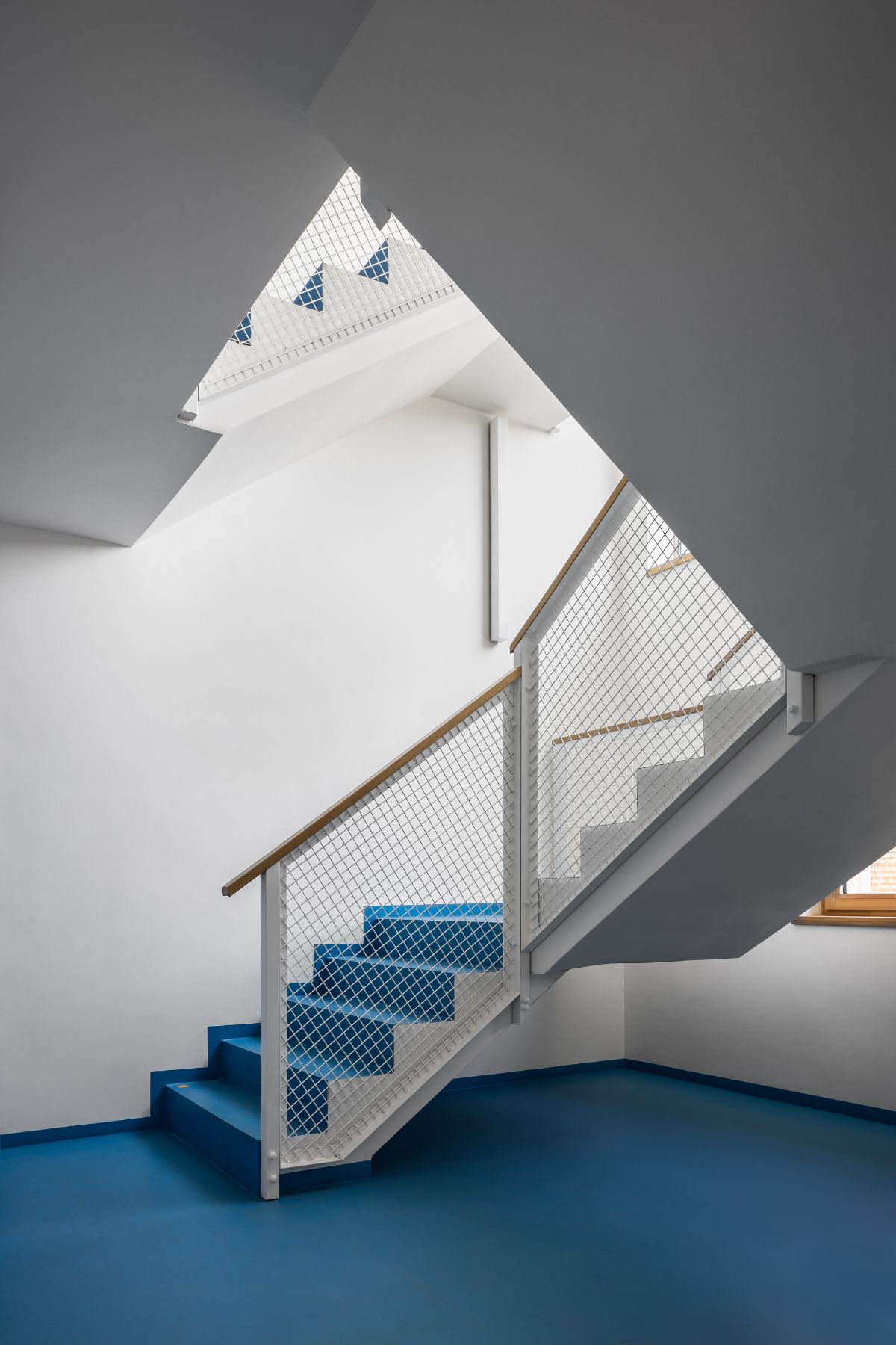The interior of the house has vibrant blue color giving a cool atmosphere in the house.