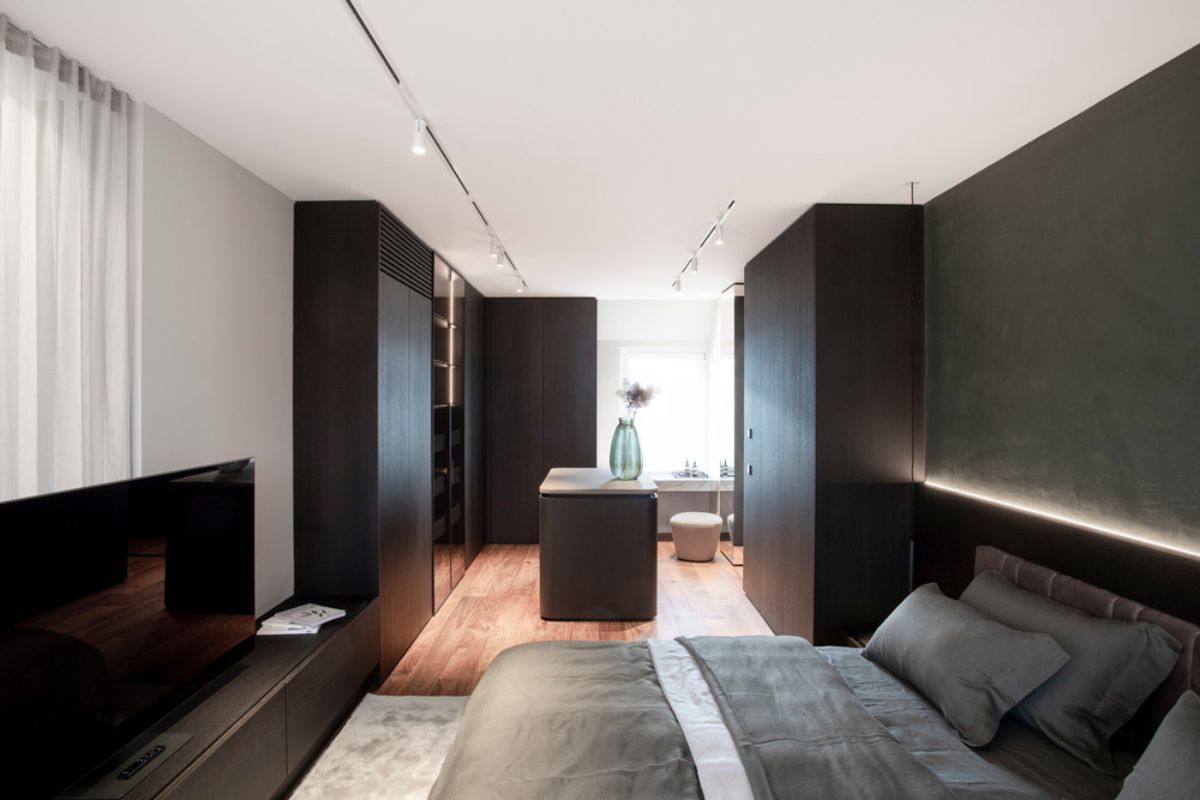 A rich shade of grey master bedroom, with en-suite bathroom.