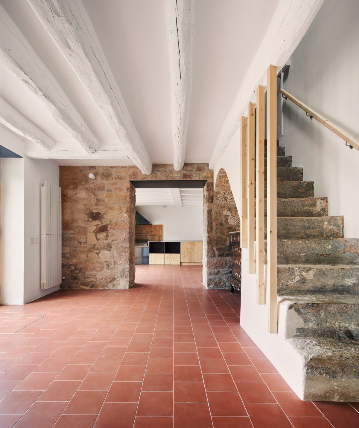 The stone staircases leads to the rooms upstairs.