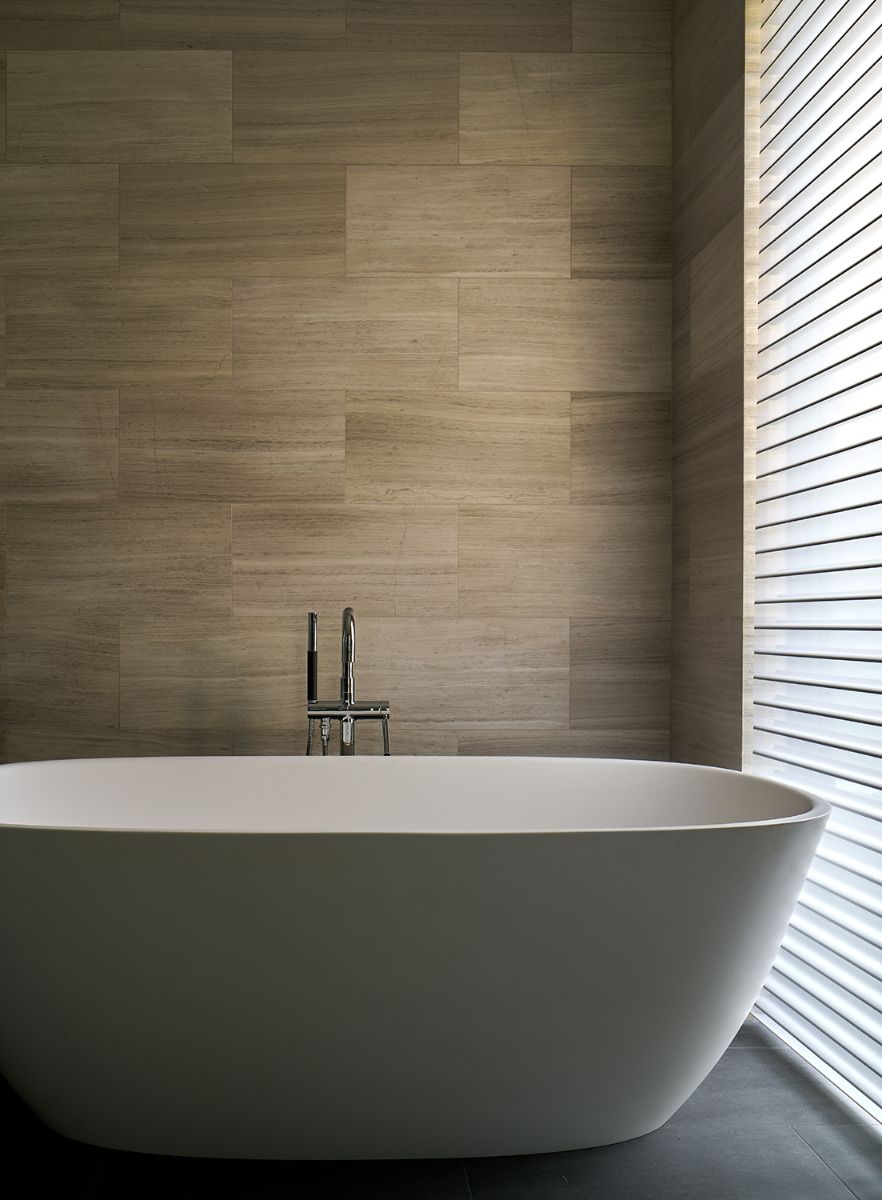 The primary room's main bath, complete with a freestanding bathtub.