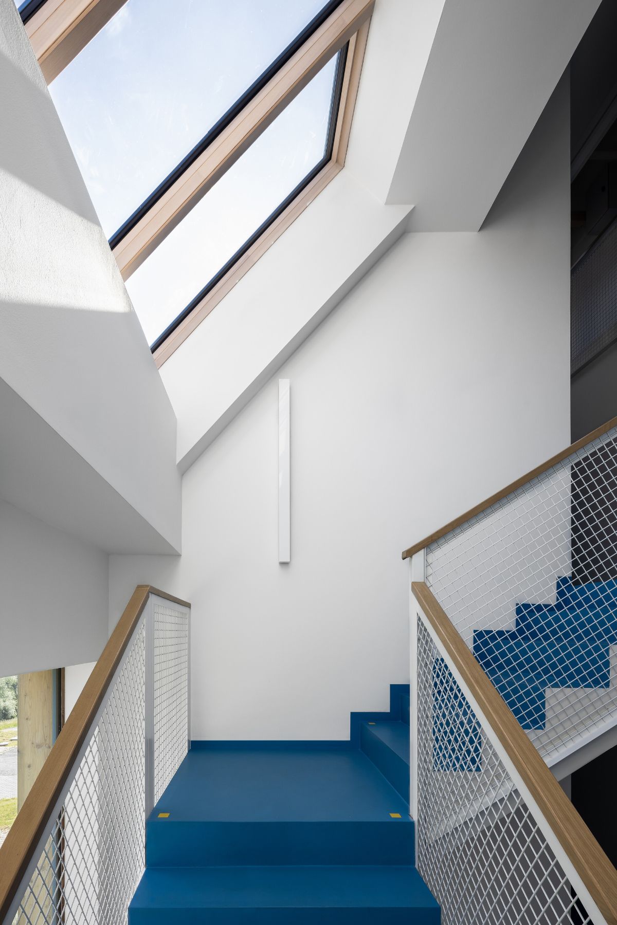 The skylight helps illuminate the staircase during the day.