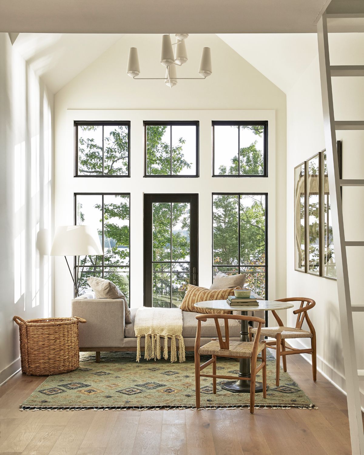 The cottage has access outdoors through a glass door. The window seat provides comfort while viewing the scenery.