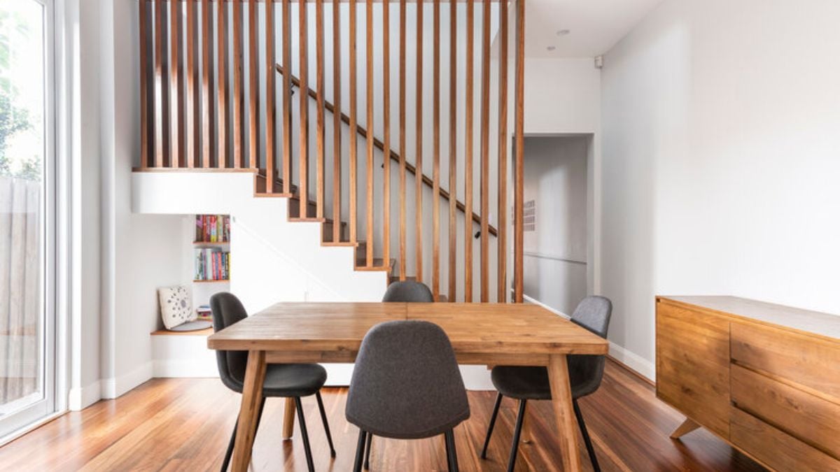 A contemporary and spacious first floor features a study area that is affixed to the side of the stairs and dining are at the center.