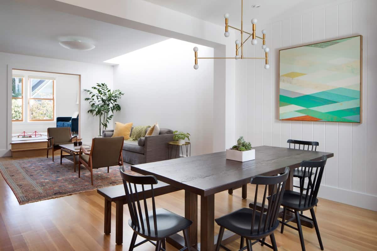 The living room and dining area are separated by an oversized opening.
