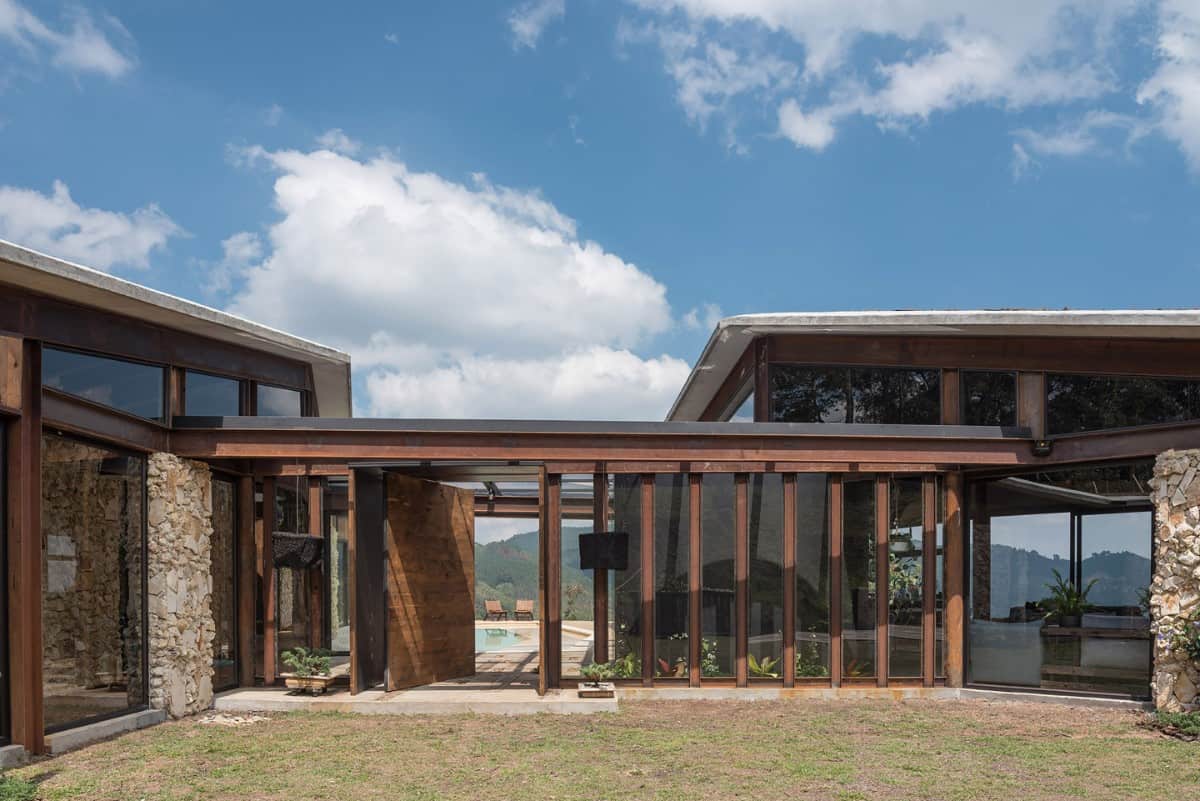 An oversized pivot door welcomes guests into a bright entry.